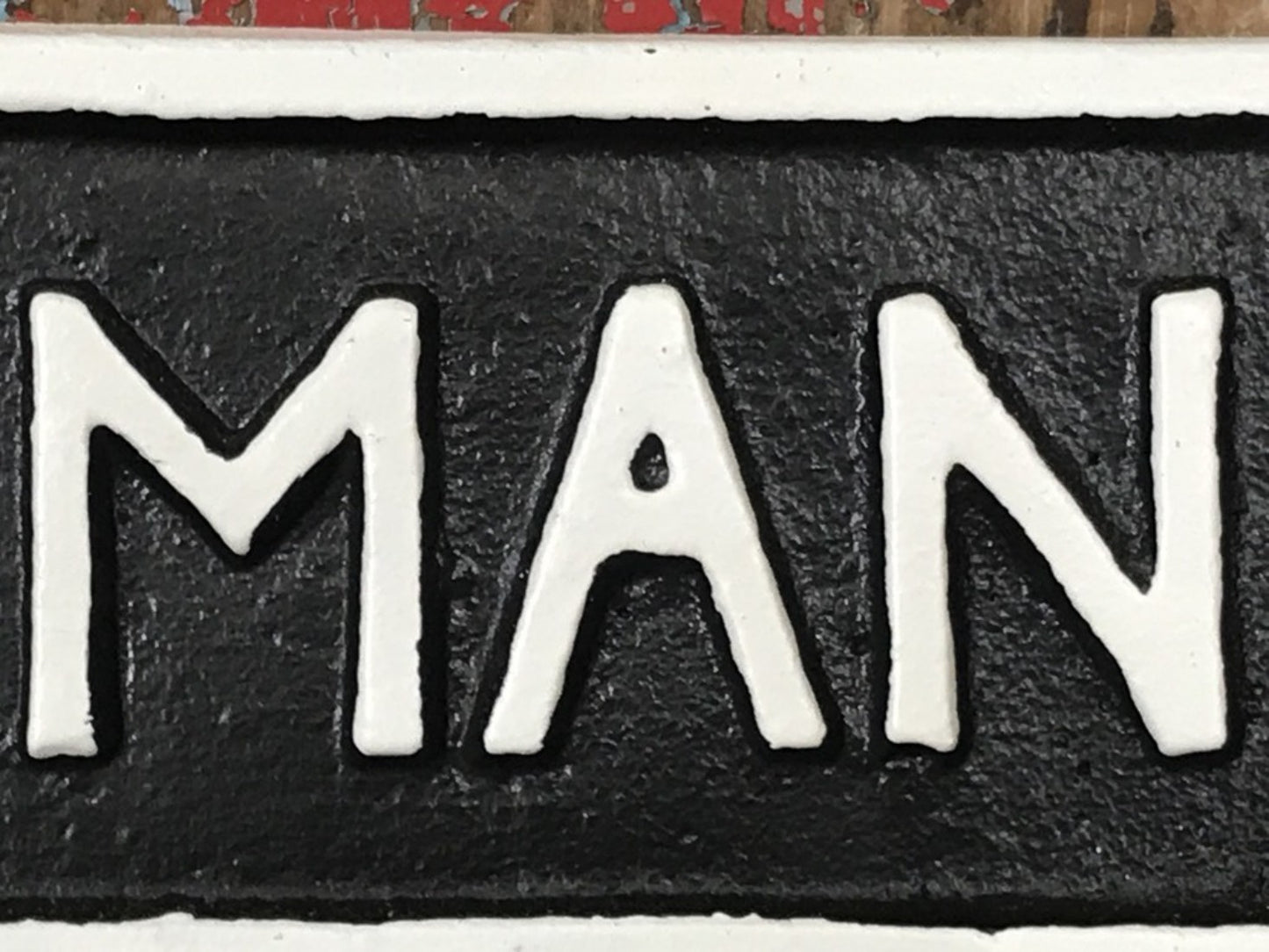 Cast Iron Sign MAN CAVE Black Background With White Text & Border