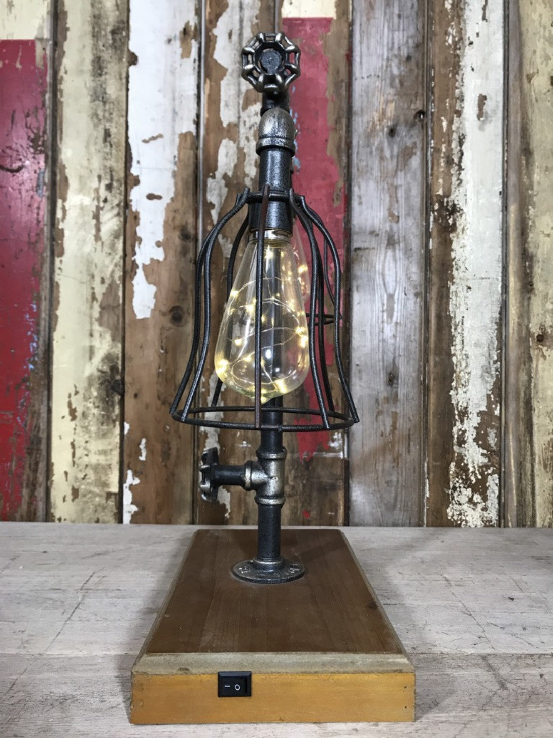 Industrial Style Pipe Double Low Level Lighting Battery Light On Wooden Plinth