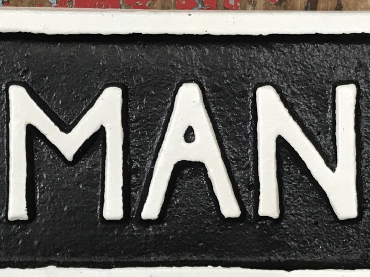 Cast Iron Sign “MAN CAVE” Black Background With White Text & Border
